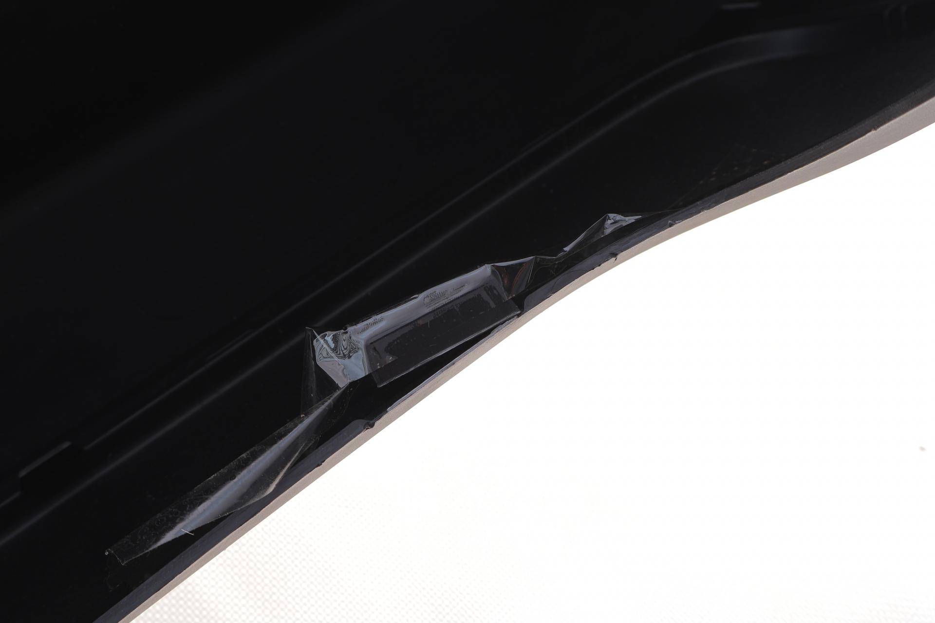 Бампер (задній) Citroen Berlingo/Peugeot Partner 08- (чорний)(пошкоджене кріплення)